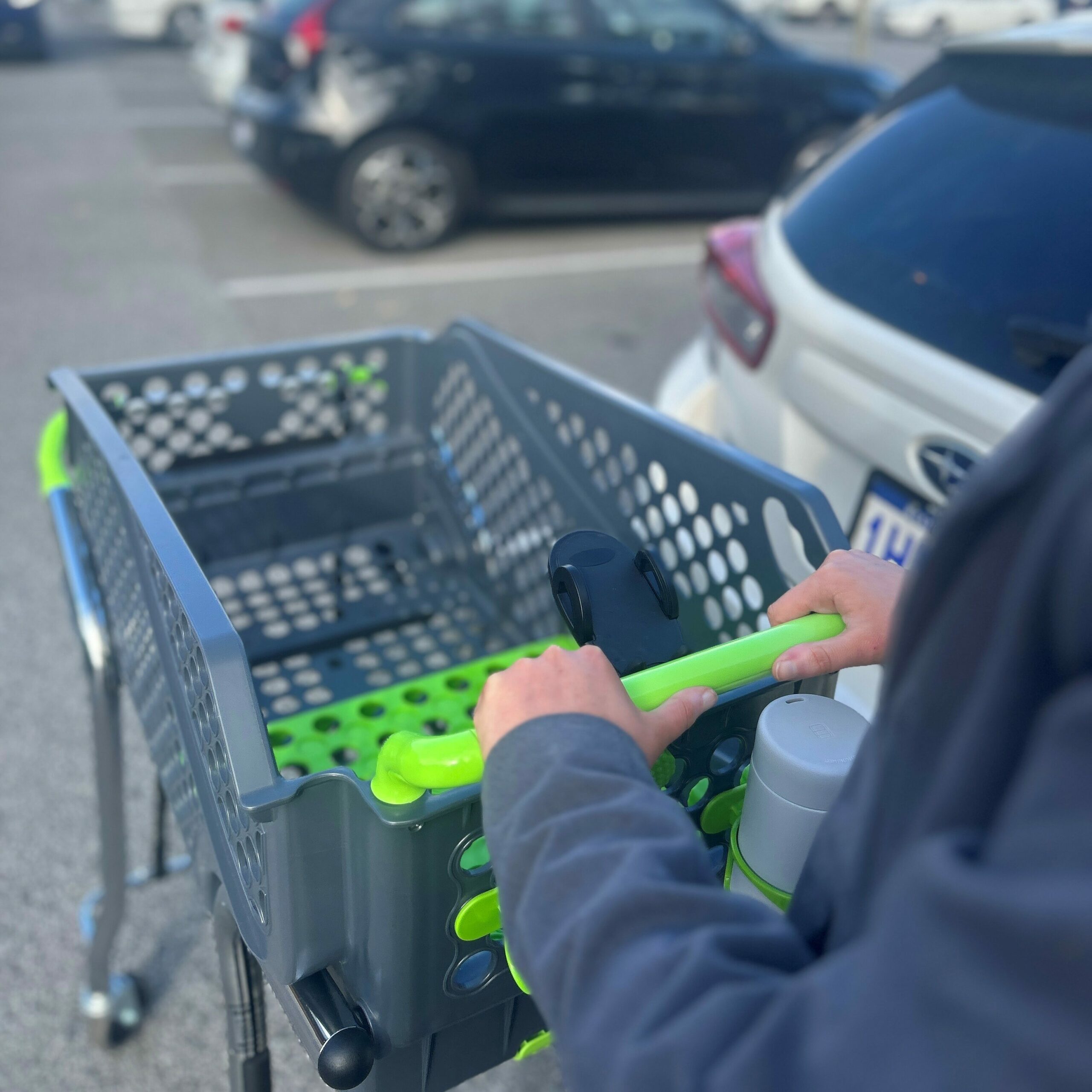 Woman shopping with Shoppacart, on way into the store.